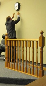 Frank McKeown, Mayor's Chief of Staff, attempts to fix the clock in Council Chambers. There are things that perhaps need fixing on the eighth floor.