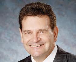 Councillor Craven didn’t smile very much during the council meeting as he voted against he budget.