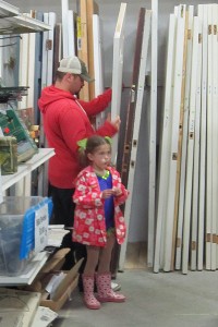 Father and daughter look over a door that was recycled and just might meet their requirement.  If it fits, the price will be right.  Little Miss Pig Tails however, wasn’t all that keen on the colour.