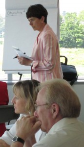 Michelle Dwyer staff liaison team leader for the Strategic Planning group watches during a session while Helen Walihura listens intently to catch the thinking of the group she was working with.