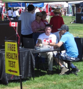 Merchants Brad Canada Day 2011 was as good as the weather gets in Ontario during the summer. A light breeze with ice cream and hot dogs available for the hungry and various service available to others. A free health test was obviously of interest to one young man.