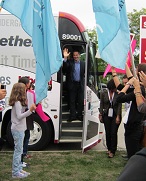 The politicians want to create excitement and as much buzz as they can.  Thus the big campaign buses and the building up of anticipation.  The handlers move the crowds up close to the bus and create a line the candidate walks along shaking hands.  All the true believers get to these events.  Here Premier Dalton McGuinty steps off the bus to a campaign event for Karmel Sakran.