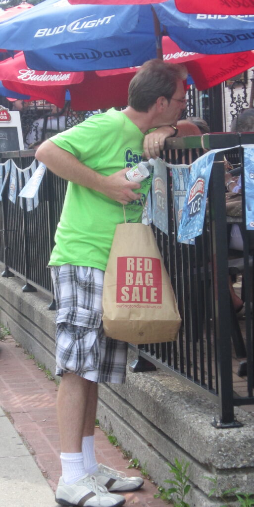 Brian Dean, top toff at the Downtown Business Association was out drumming up business for those of his members that took part in the Red Bag Sale.  Too many of his members let the community down last Sunday.  Keeping the doors closed while the city works at getting people out on the street isn't thew way the game is played.