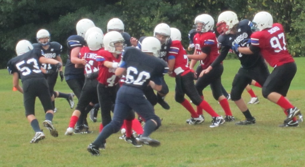 It was raining, the ground was wet, slippery and football was hard to hang onto - but the game went on.