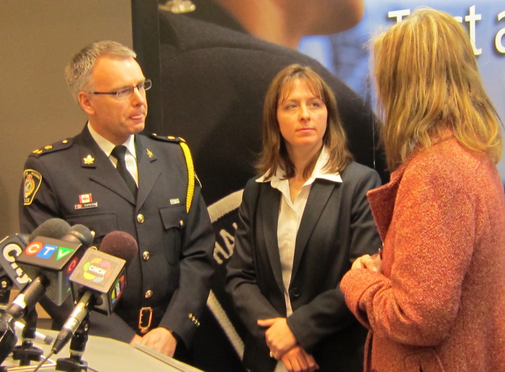 Deputy Chief Andrew Fletcher and Detective Donna Whittaker answer media questions during the display of all the cash and other valuable recovered during a bank break-in where the bad guys almost got away.  