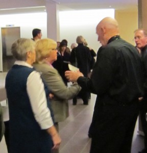 The firsttwopeople to enter the Mian Theatre for a paid performance hand their tickets to an usher.
