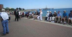 The ceremonies over the Naval Promenade becomes the fous with the Seniors' out in force listening to the All MAle Welsh Choir. Strolling along is Craig Stevens, the city's project manager on the pier project. He direction and oversight kept the project going when it got a little wonky at times - but that's another story.