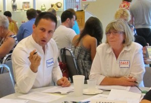 Trevor Copp, the Burlington actor who mobilized trhe arts into a Collective makes a point on leadership while Executive Director of the Burlington Museum's operation listens.