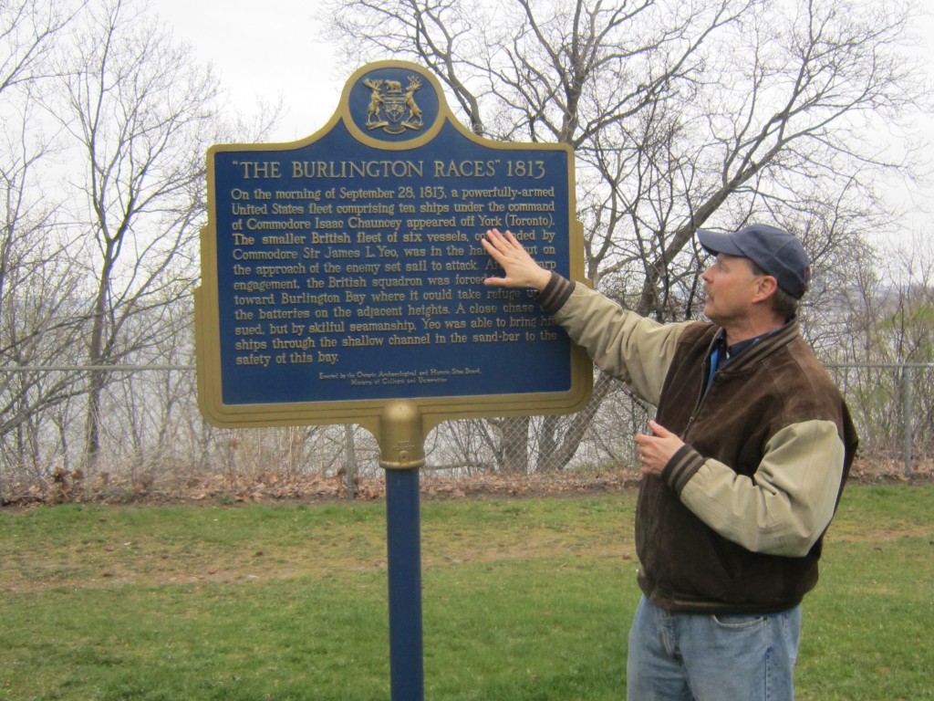 Wilson Rick at plaque in Heights