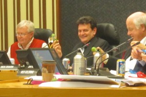 Councillor Rick Craven, centre, with a copy of the 2013 budget on a memory stick. Craven did a superb job of chairing the budget committee last year.  He will have no argument with candidate Henshell over the need for additional shopping facilities in Aldershot - getting themt there has been the challenge.