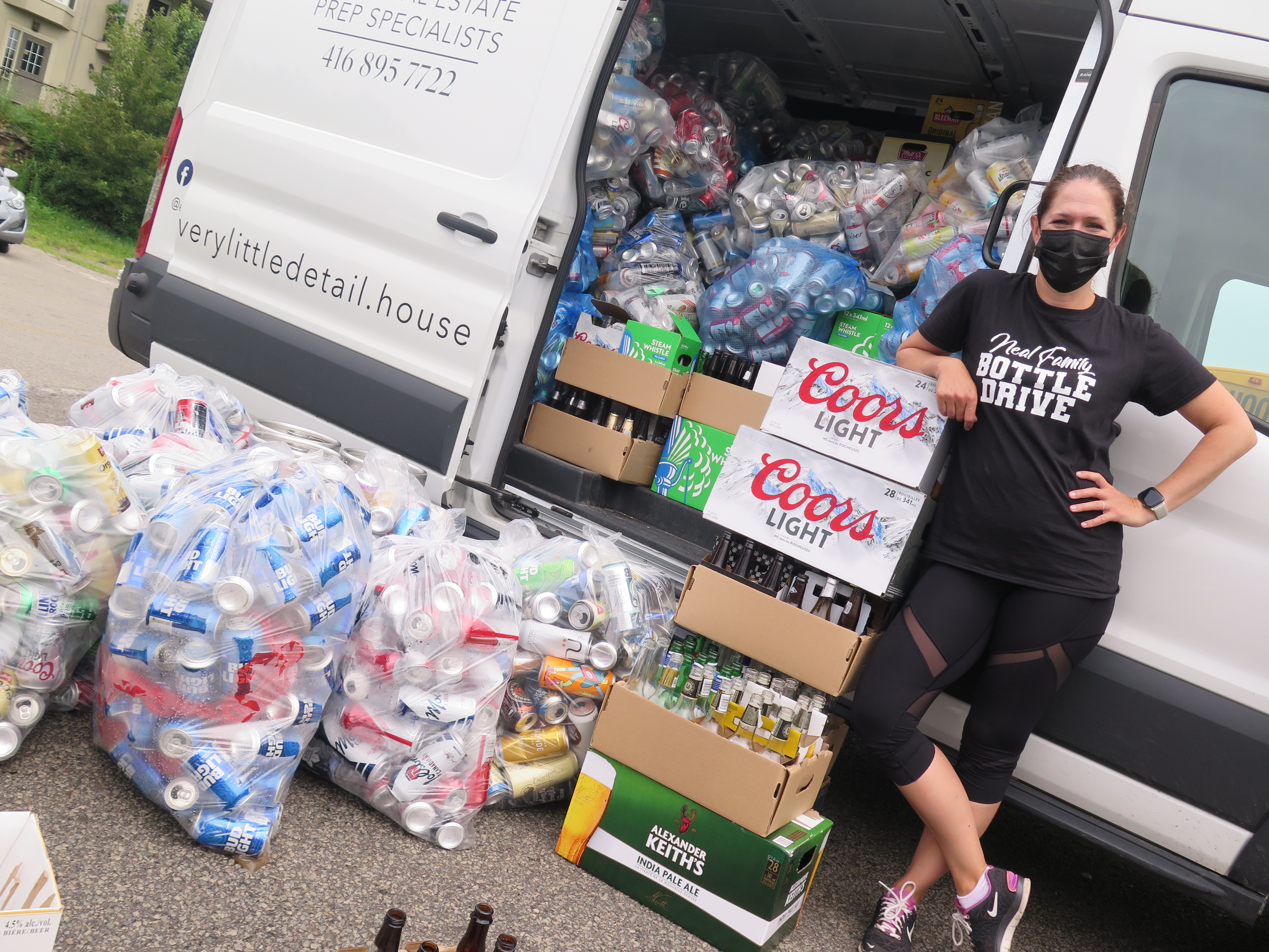 Julie Neal checking on a load of beer cans that were trucked to Stoney Creek to be redeemed for cash