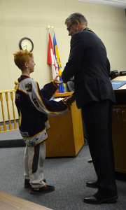 Boy with red hair Giving back