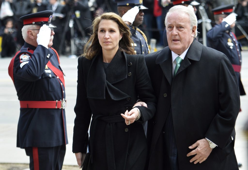 Former Canadian prime minister Brian Mulroney and daughter Caroline arrive at the church for the state funeral for the late Jim Flaherty in Toronto on Wednesday, April 16, 2014. THE CANADIAN PRESS/Nathan Denette