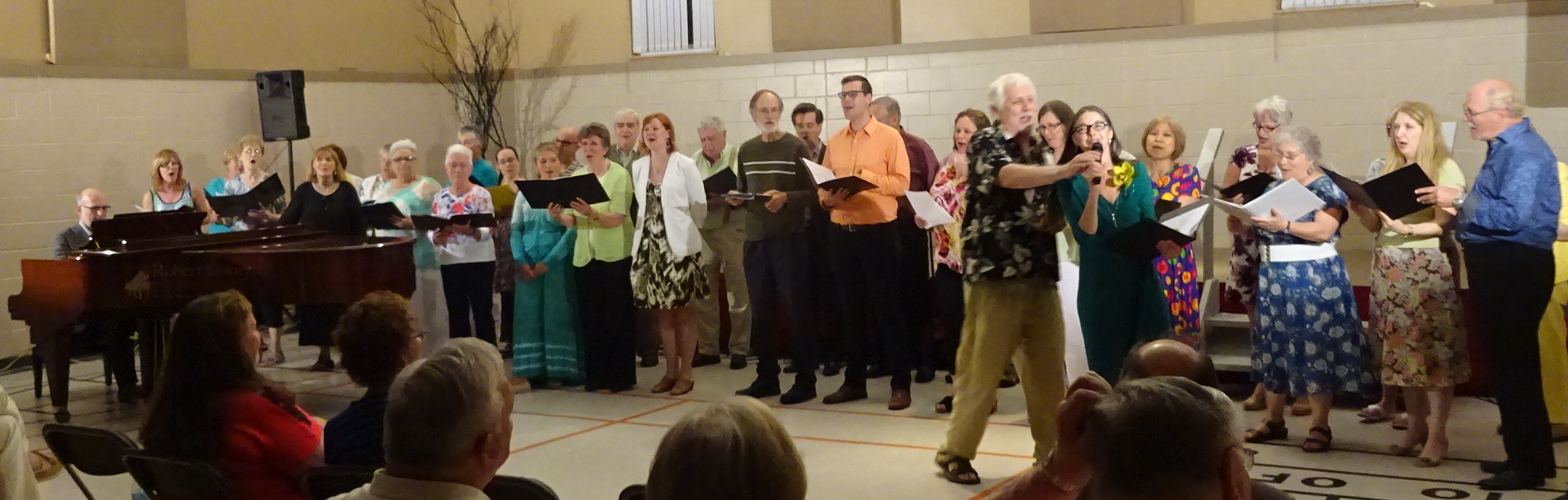 Choir with Bob Missen on stage