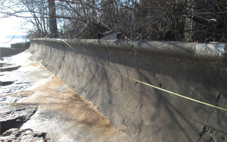 concrete-wall-top-of-bank-issue-blue-water