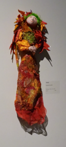 doll-on-wall