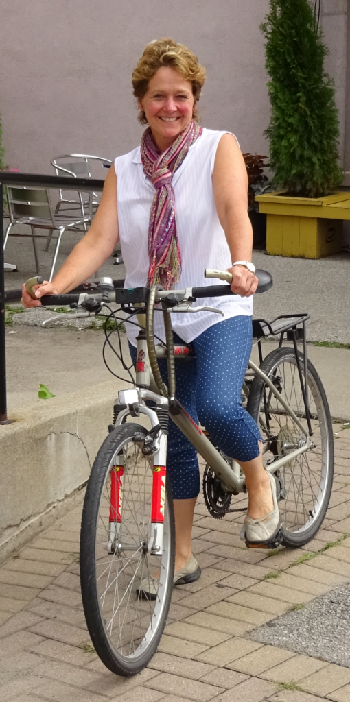Gottlob on bike looking direct - good smile