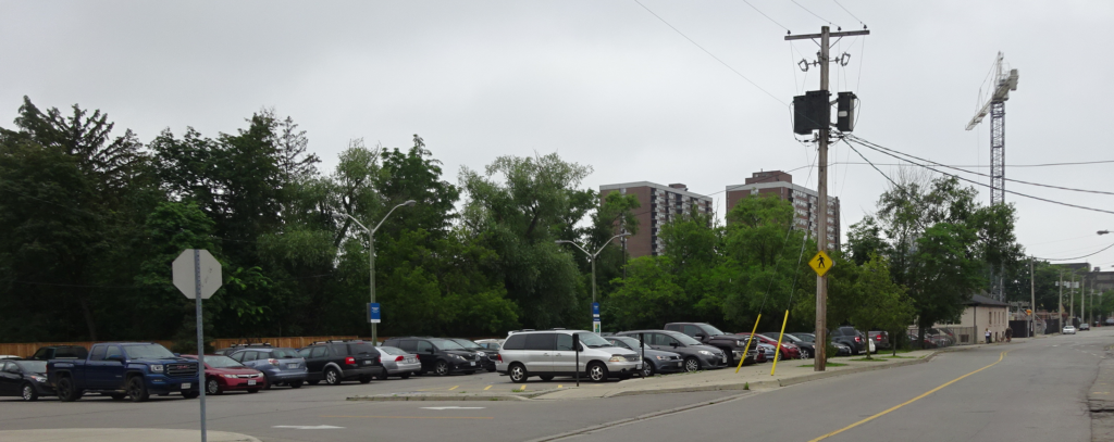 John opposite tire store - pk lot - city owned