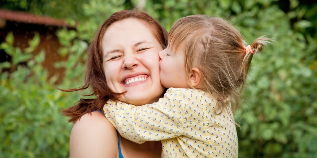 Mother with child - kissing