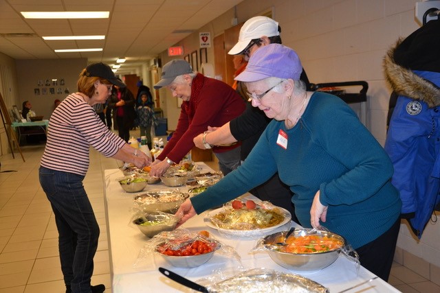 Pic 2 - ladies at a food table