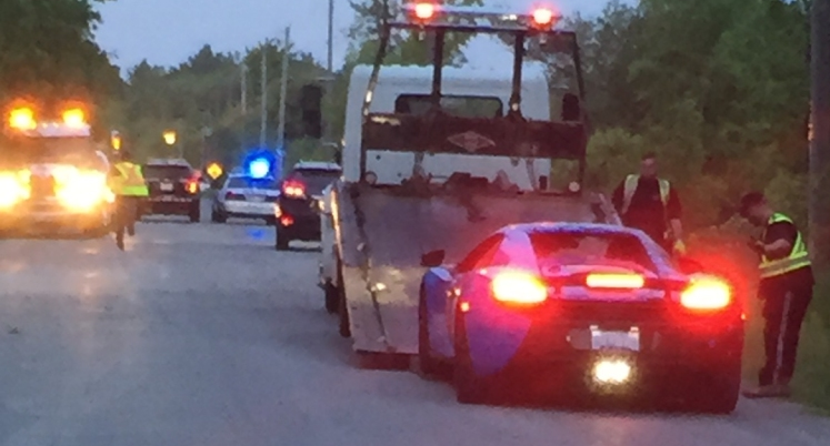 Police - impounded vehicle being loaded