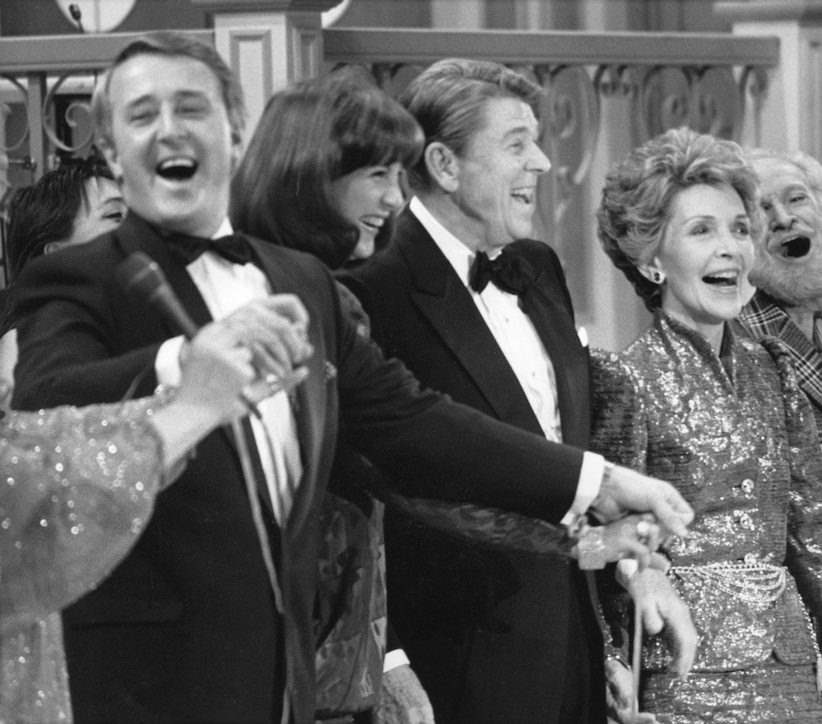 Former Prime Minister Brian Mulroney leads the chorus in singing an Irish song on stage with his wife (Mila) and U.S. President Ronald Reagan and First Lady Nancy Reagan at the conclusion of a gala performance in Quebec City March 17, 1985. (CP PHOTO/Bill Grimshaw)