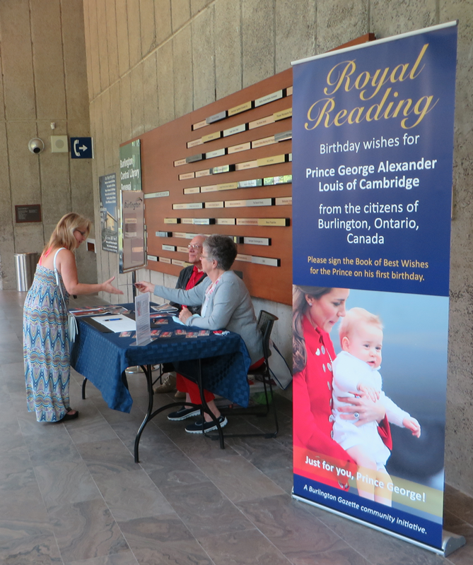 Resident signing Best Wishes Royal Reading