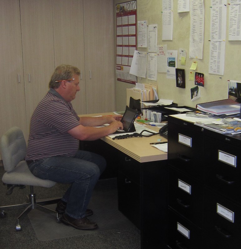 S  Henry at his desk