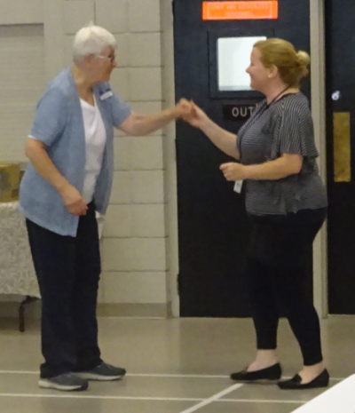 Staff dance at sesnior event