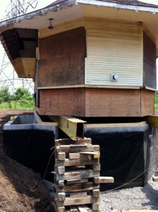 Step 1 Being lowred onto the concrete foundation June 24-14
