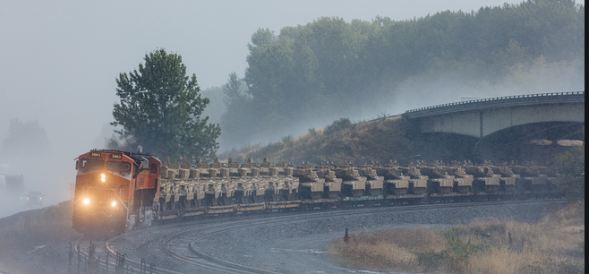 army tanks on flatbeds